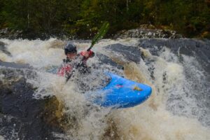 A man on a kayak boat