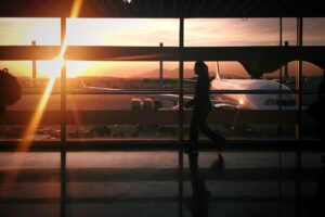 A woman walking to the airport terminal