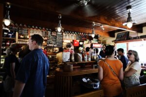 Group of people drinking in front of the cafe desk