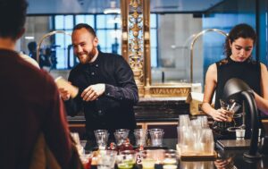 Hotel staff serving drinks to the costumers