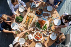 Family and friends eating together