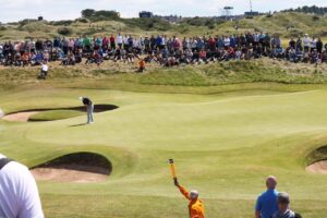 Group of people watching a golf tournament