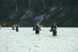 Group of men fishing together