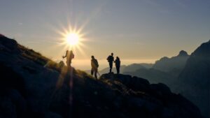 Group of people hiking in the mountain to see the sunset