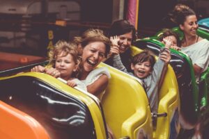 Mother and daughter riding a roller coaster