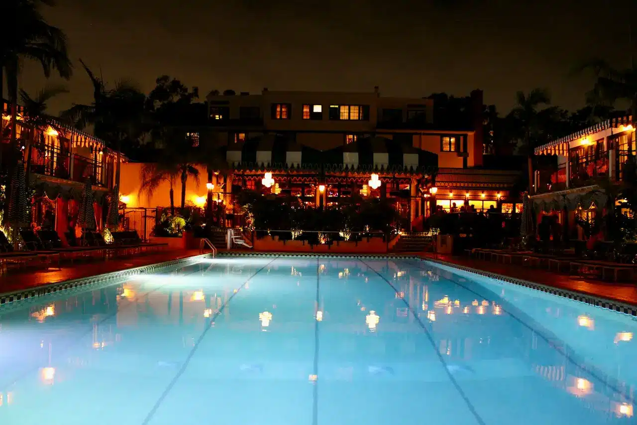 Night View of a Hotel with a Large Swimming Pool